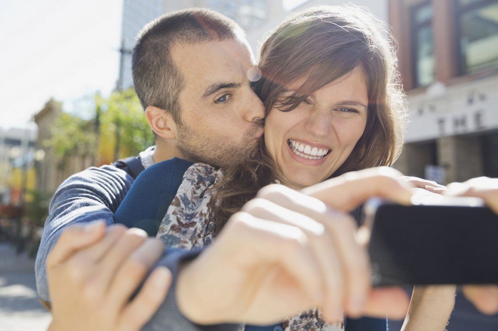 Couple taking selfies