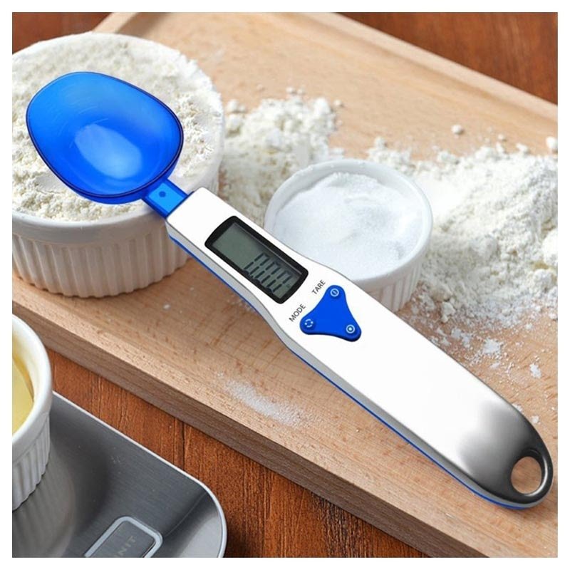 A digital scale and spoon