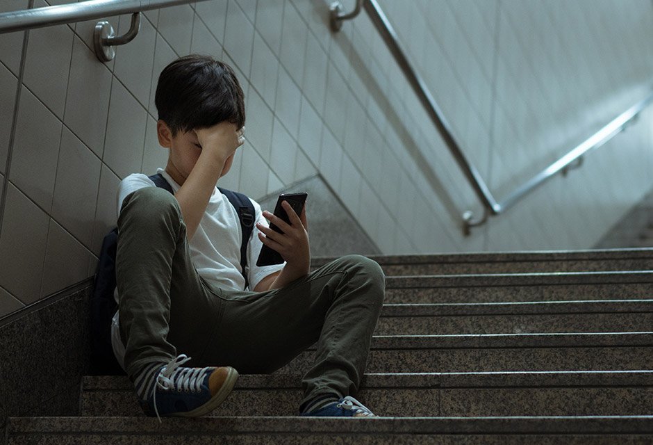 Boy looking at a mobile phone